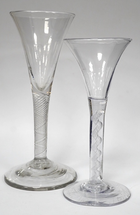 Two air twist stem drawn trumpet wine glasses, c.1750, the smaller example diamond point engraved ‘Miss Molly Strickland’, largest 19.2cm high. Condition - large wine glass - good, smaller glass - ground off foot and two